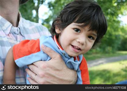 Young child being held