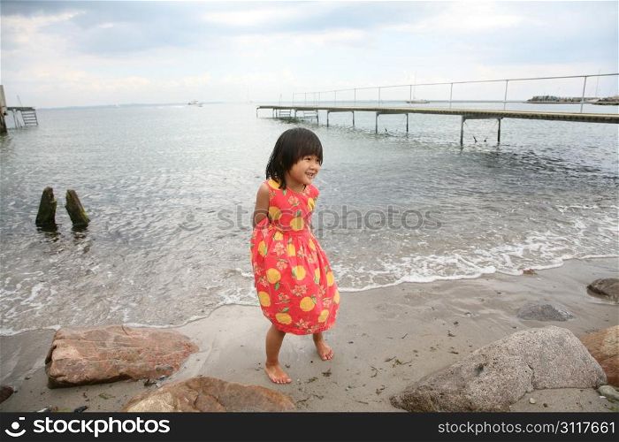 young child having fun at the beach
