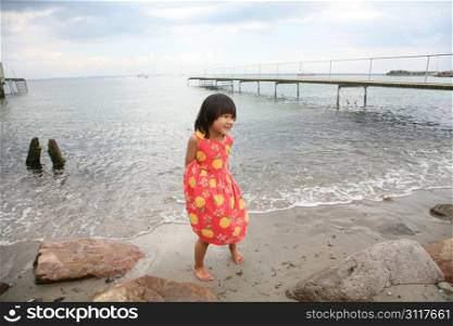 young child having fun at the beach