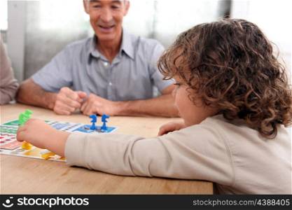 Young child playing a board game