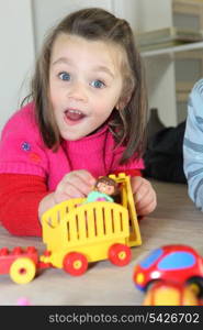 Young child playing with her toys