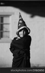 Young child pretending to be a wizard