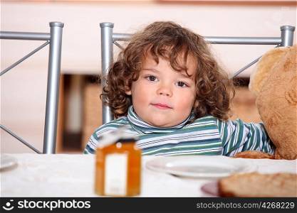 Young child waiting to eat breakfast