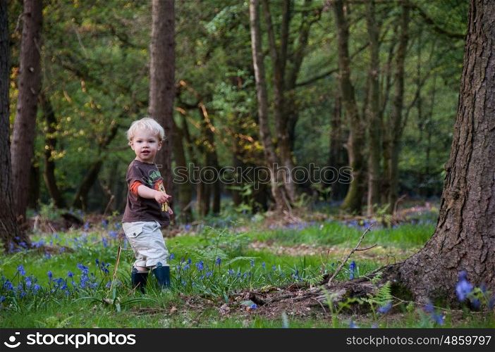 Young child walking in the woods