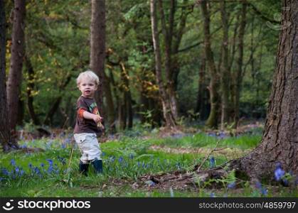 Young child walking in the woods
