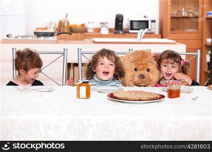 Young children eating crepes