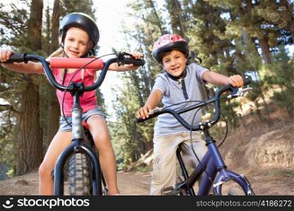 Young children on bikes in country