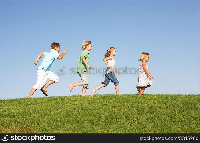 Young children running through field