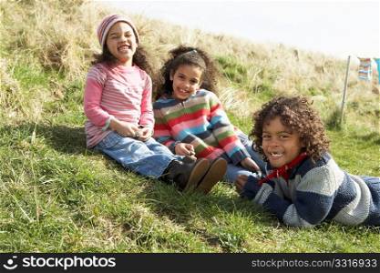 Young Children Sitting Outside In Caravan Park