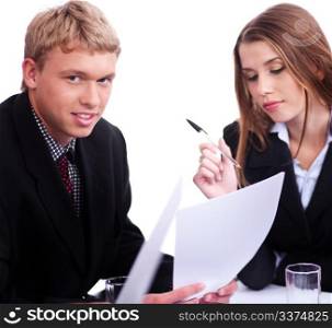 Young confident businessman with his collegue looking at camera over white background