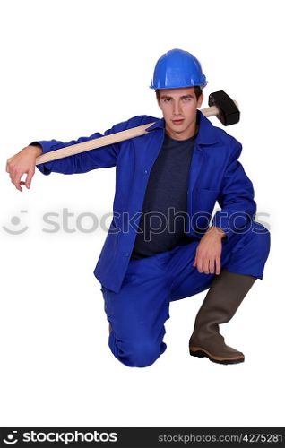 Young construction worker on white background