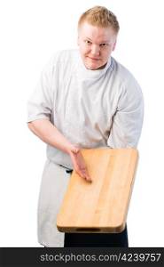 Young cook demonstrate something on chopping board