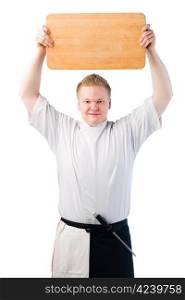 Young cook holding chopping board over his head, white isolated background