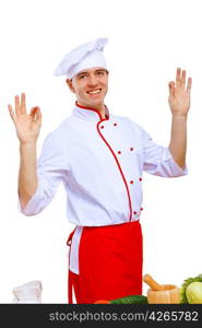 Young cook preparing food wearing a red apron