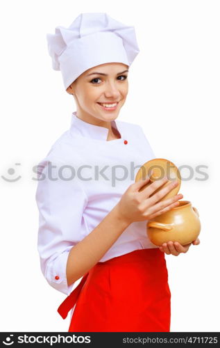 Young cook preparing food wearing a red apron