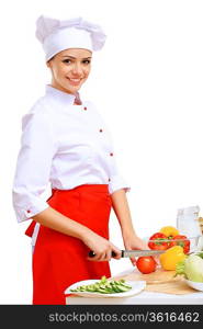 Young cook preparing food wearing red apron