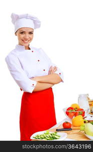 Young cook preparing food with red apron