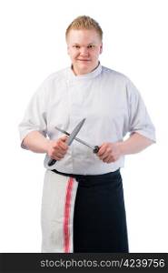Young cook sharpening his knife, white isolated background