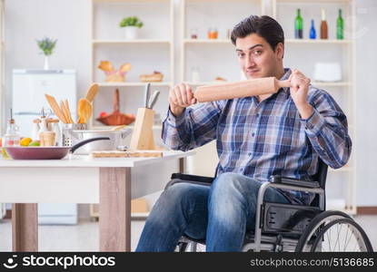 Young cook with roller preparing dough meal