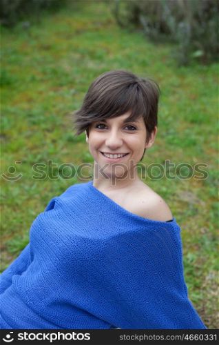 Young cool girl dressed in blue in the park