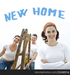 Young couple and friend improving their new home.