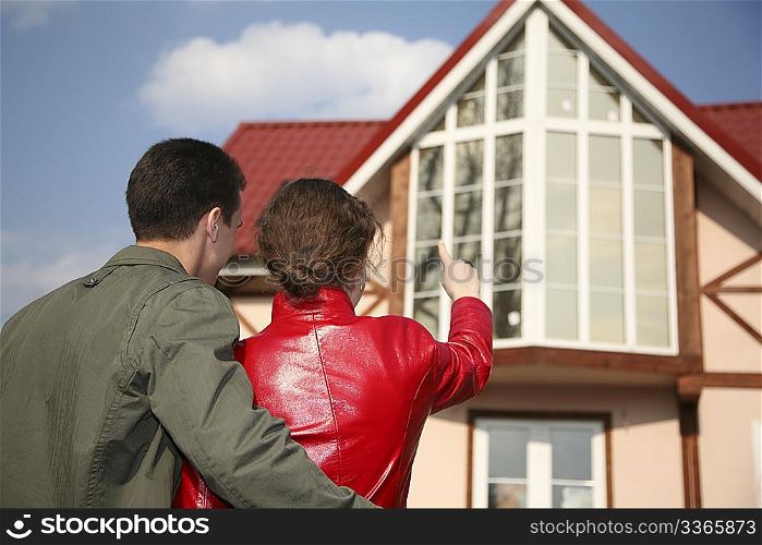 young couple and house