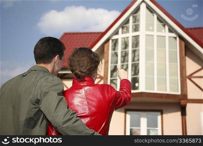 young couple and house