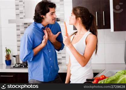 young couple argue themself in the kitchen at day time