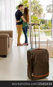 Young couple arriving the hotel for holidays