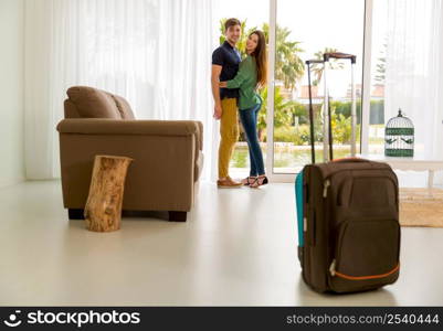 Young couple arriving the hotel for holidays