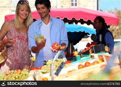 Young couple at a market stall