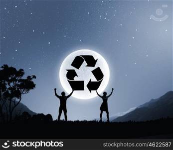 Young couple at date. Silhouettes of young couple against full moon
