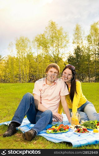 Young couple at romantic picnic