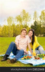 Young couple at romantic picnic