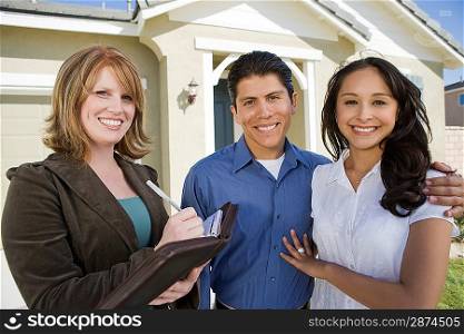 Young couple buying house, signing contract