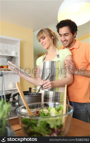 Young couple cooking