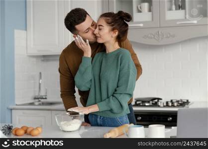 young couple cooking home 7