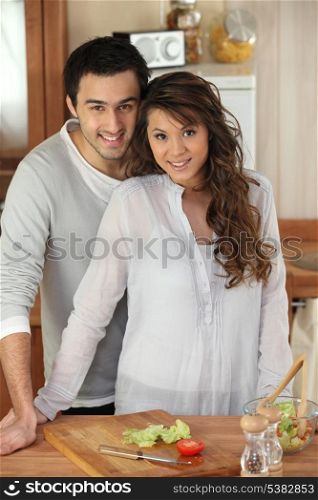 Young couple cooking in a kitchen