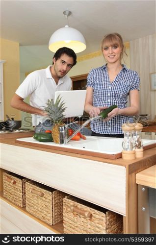 Young couple cooking together