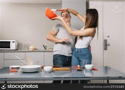 young couple cooking together kitchen