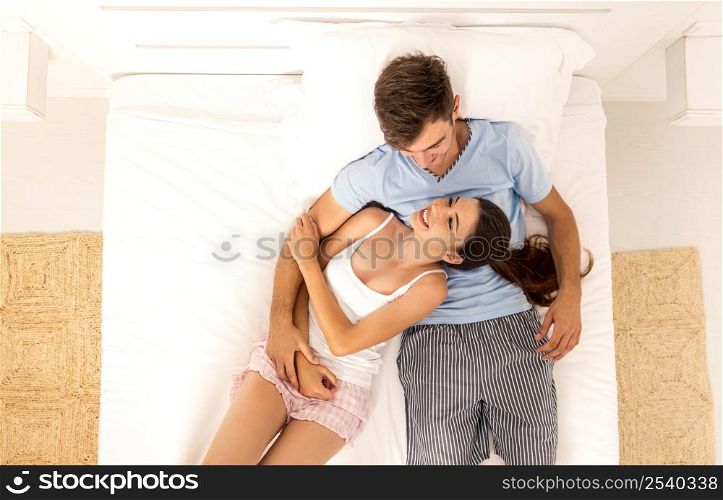 Young couple dating on a hotel bedroom