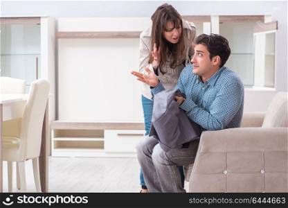 Young couple disappointed with price in furniture store
