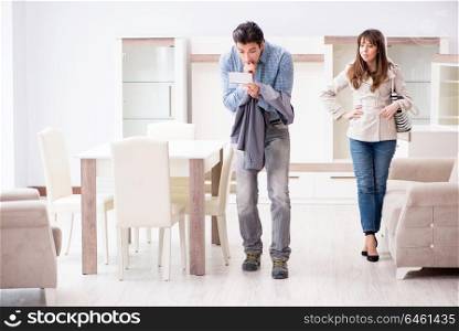 Young couple disappointed with price in furniture store