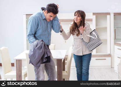 Young couple disappointed with price in furniture store