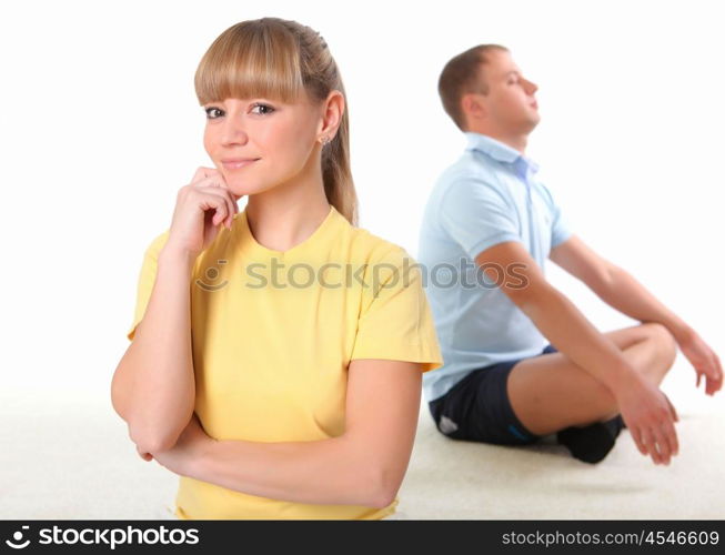 young couple doing yoga exercise together indoors