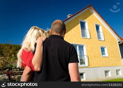 Young couple dreaming of a new home