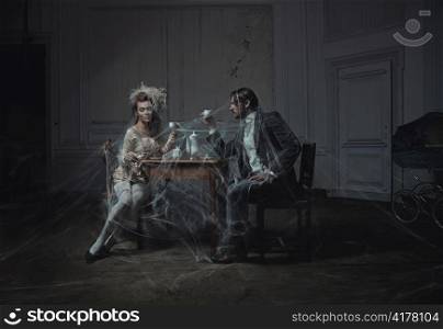 Young couple drinking coffee in an old castle