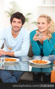young couple eating ravioli