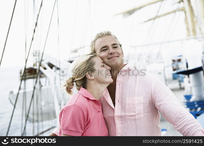 Young couple embracing each other and smiling