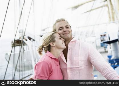 Young couple embracing each other and smiling